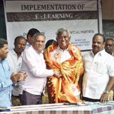 Rtn. AKS Jawarilal Jain, Dist. Governer.  RI Dist 3231
facilitating PDG Benjamin Cherian, Advisor, Schools into smilesat Municipal Hr.Sec. School, Gudiyattam 
